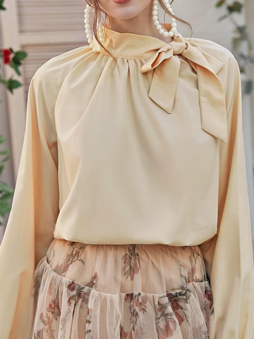 Tie Neck Raglan Sleeve Solid Blouse